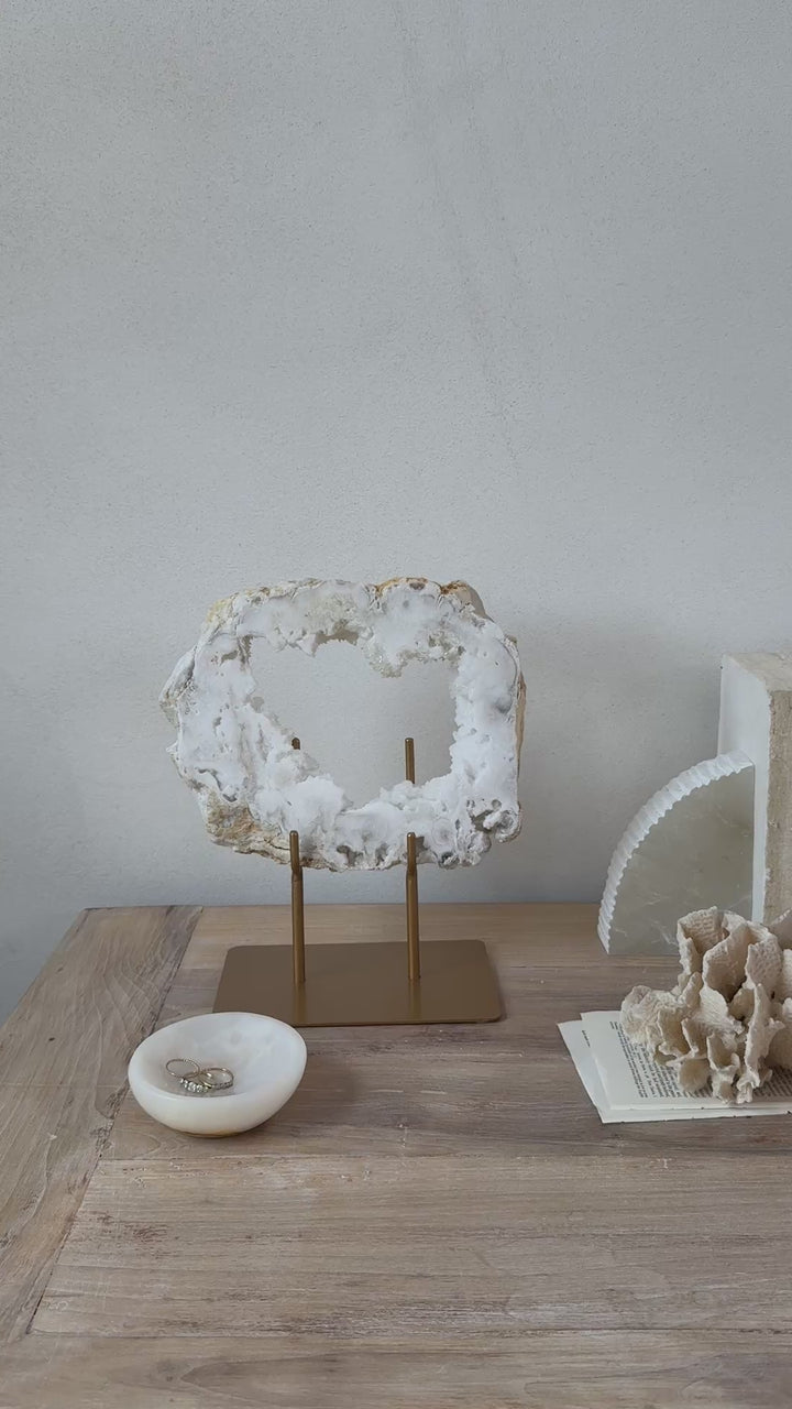 Natural crystal sculpture on stand