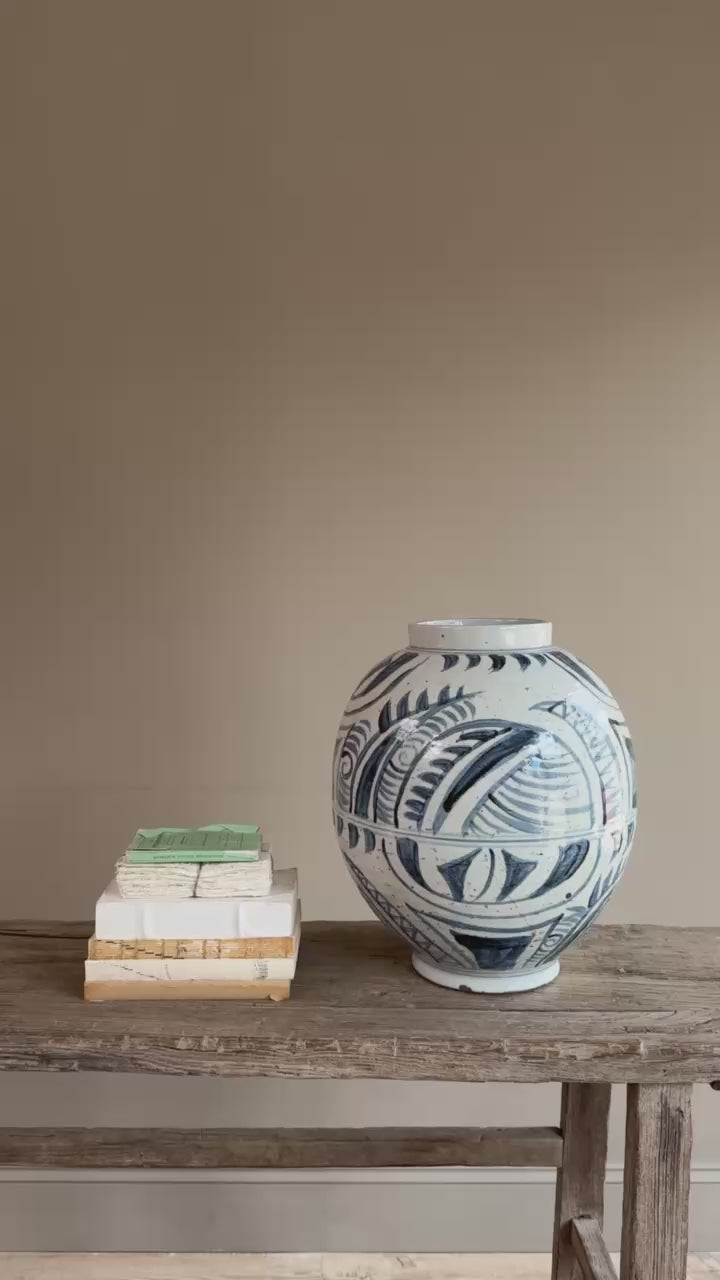 Video of the hand-painted blue and white porcelain vase, showcasing its elegant proportions and artisan-painted finish from every angle.
