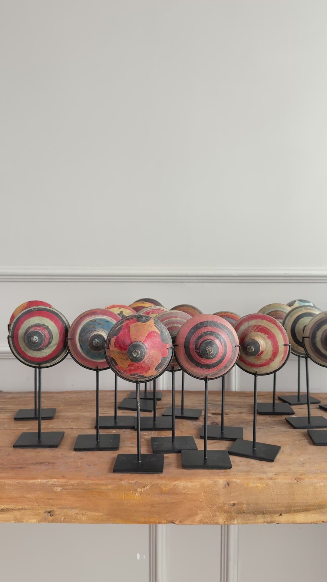 Antique small spinning top on stand