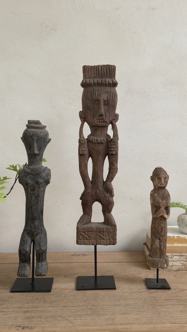 Antique hand-carved wooden statues on stand | Wira