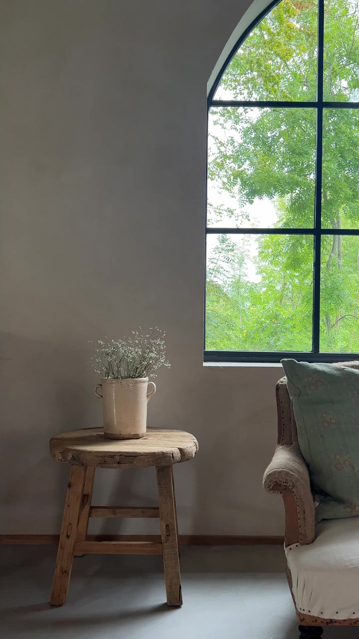 Large reclaimed elm round side table video in an arched window