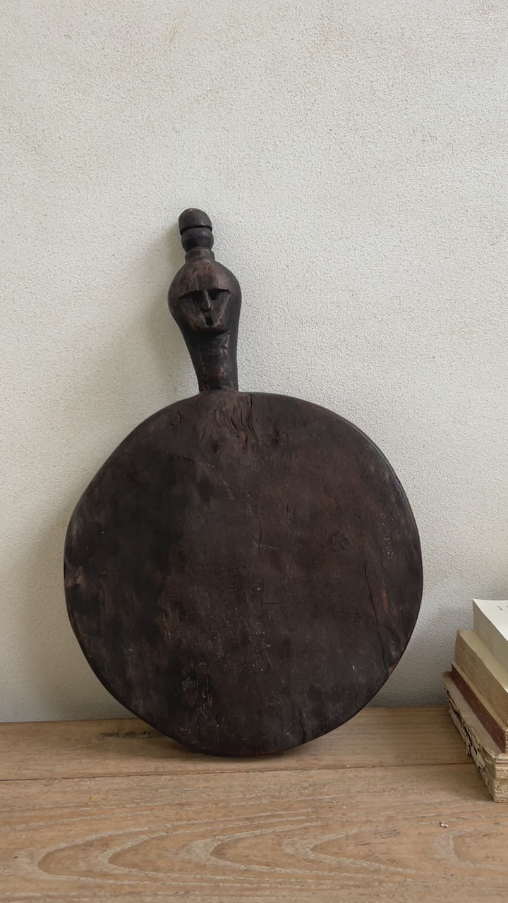 Round hand-carved wood pounding board | Rama