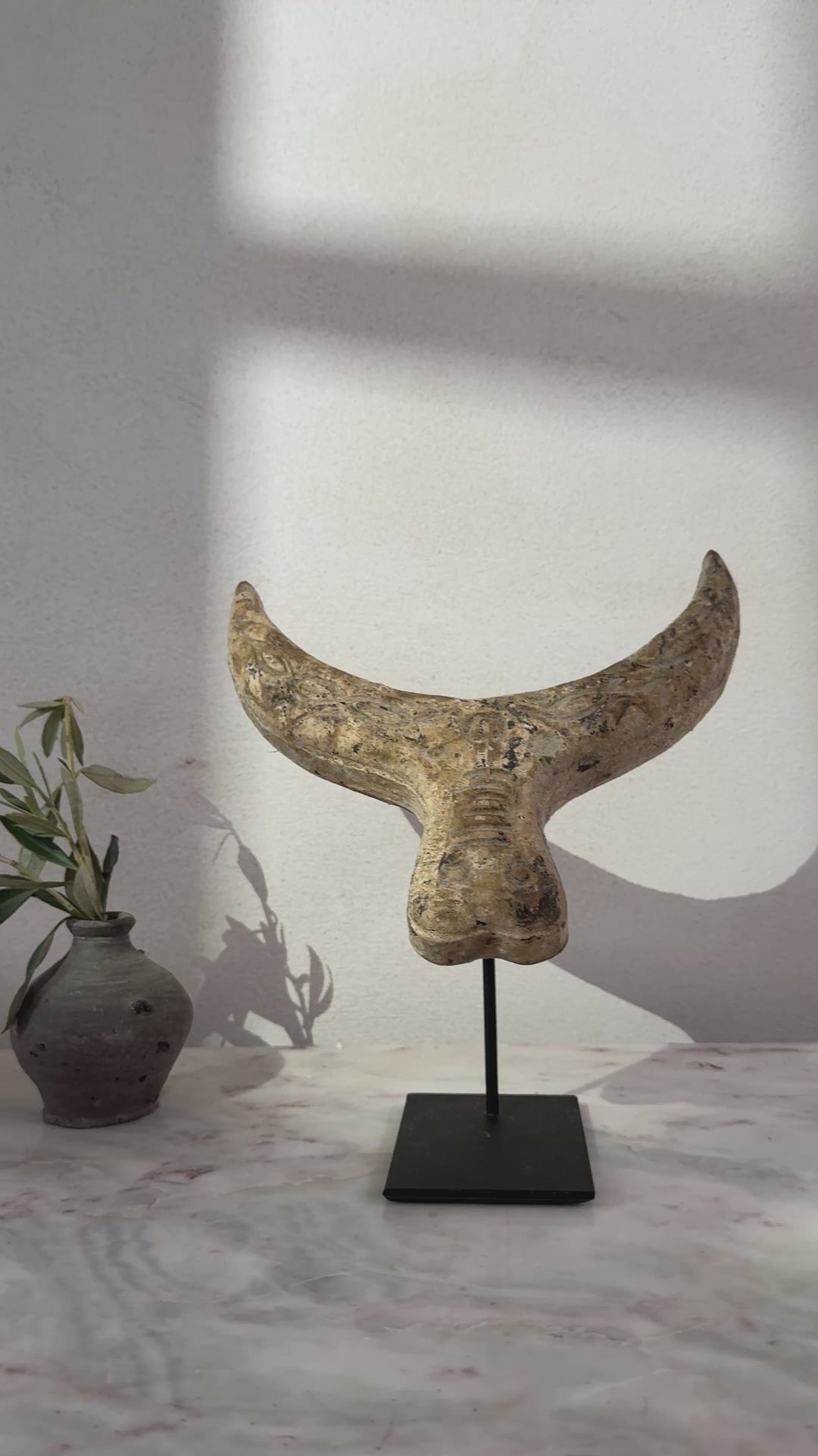 Primitive wooden cow horn sculpture