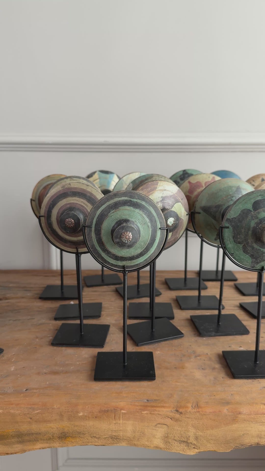 Antique small spinning top on stand