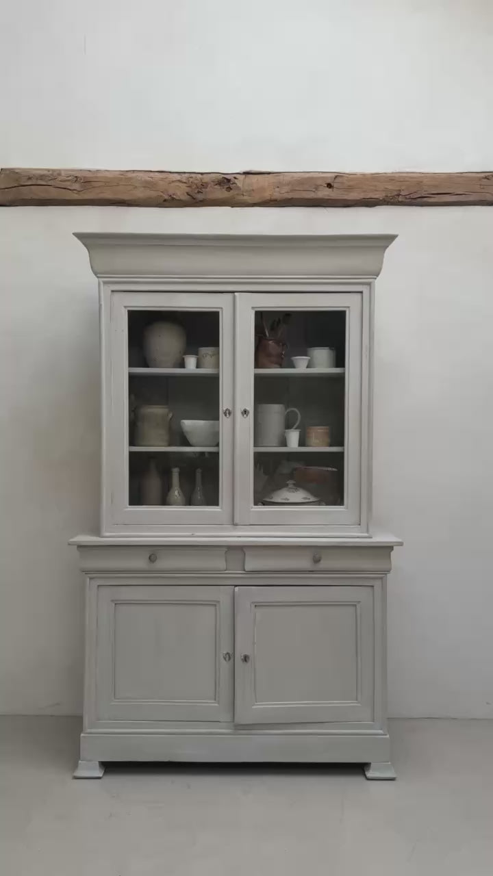 Video of the antique French painted oak Buffet Deux Corps cabinet in a contemporary country setting.
