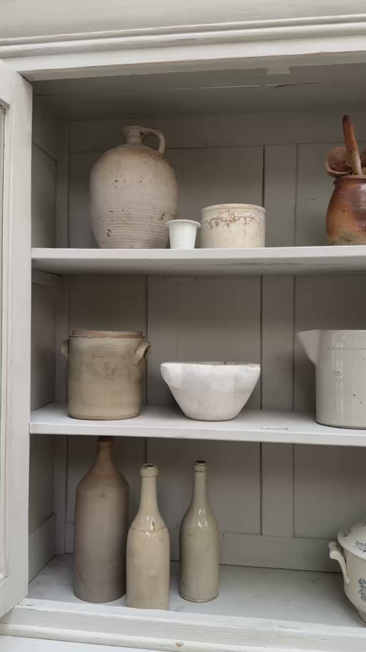Video showing the glazed interior display shelves and storage of the antique French Buffet Deux Corps.
