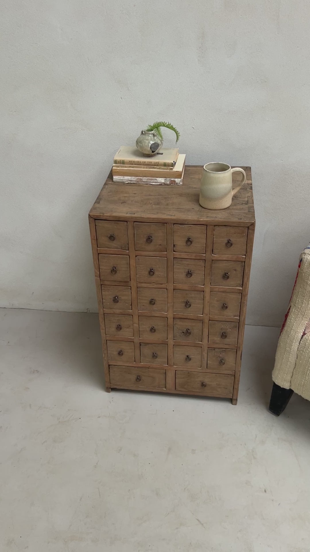 Set of 22 small drawers for collectables in a side table