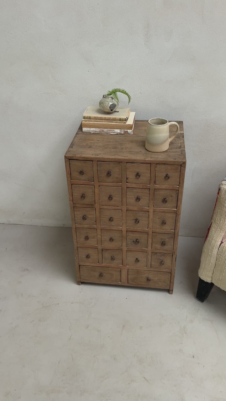 Set of 22 small drawers for collectables in a side table