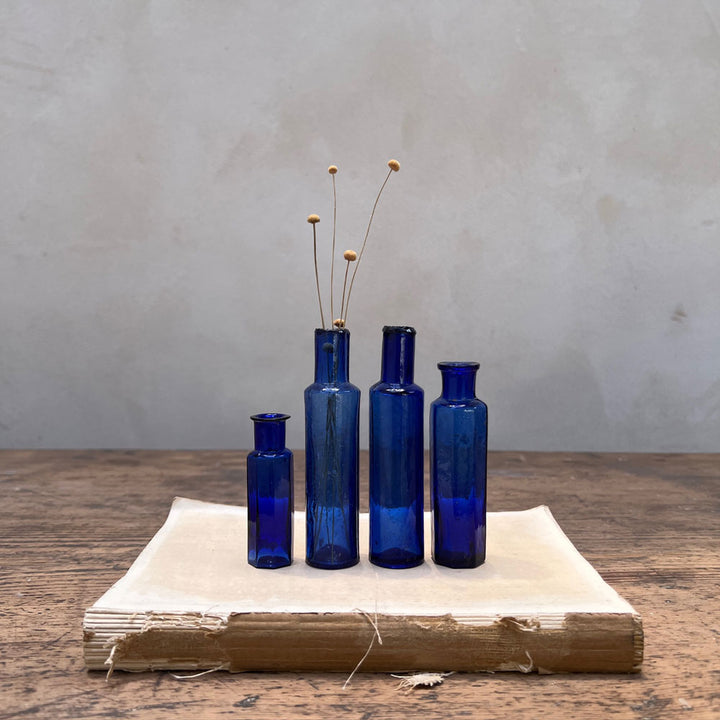 Set of Four Blue Victorian Bottles