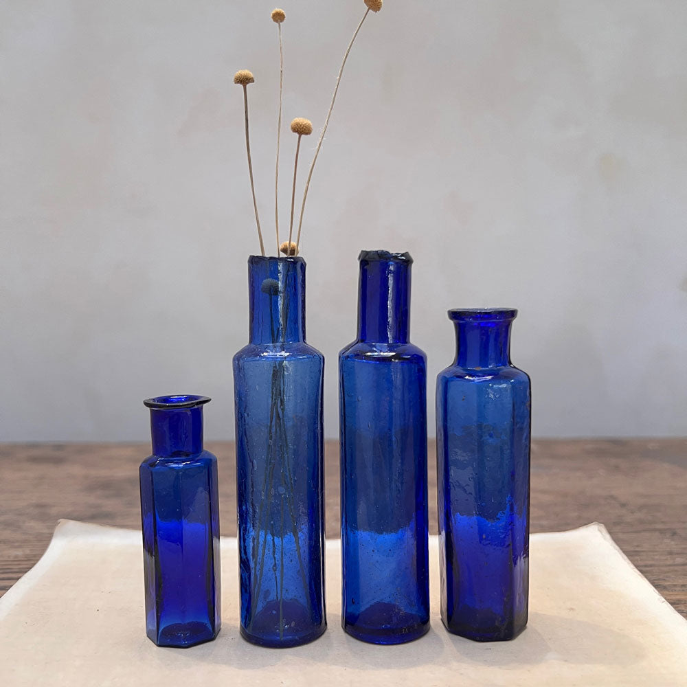 Set of Four Blue Victorian Bottles