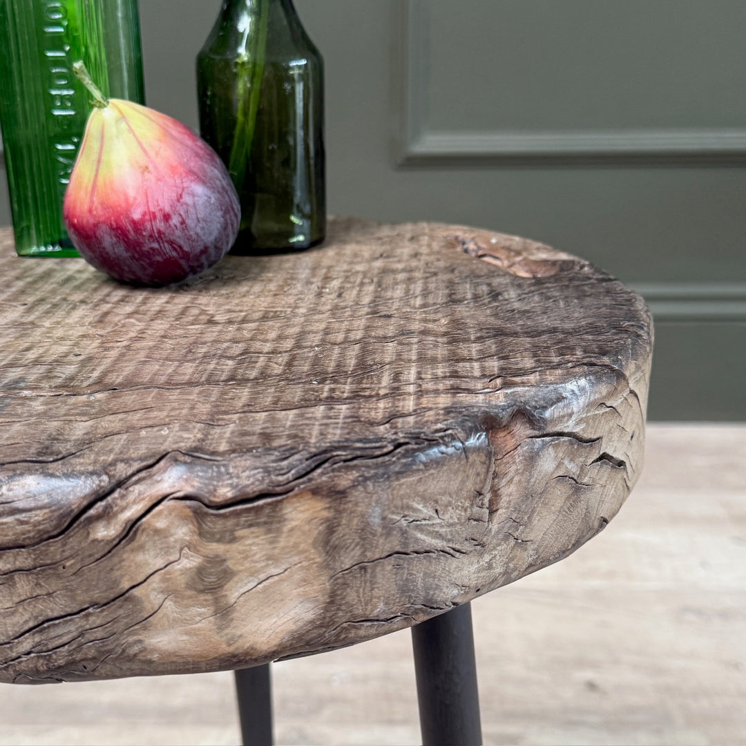 Side view of the Small Rustic Elm Side Table Eva highlighting the natural elm wood grain and rustic texture.