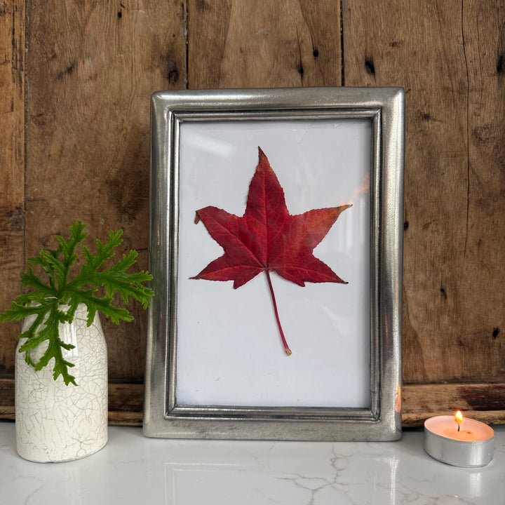 a solid pewter picture frame which can be wall hung or stand freely on a side table. It is made by the last pewter potters in Europe who are based in France. 